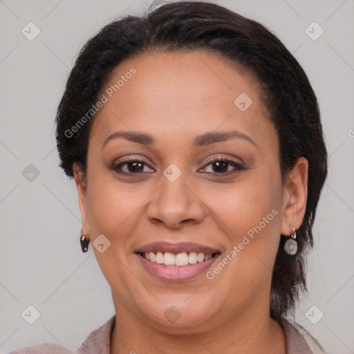 Joyful latino adult female with medium  brown hair and brown eyes