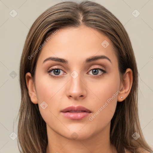 Neutral white young-adult female with long  brown hair and brown eyes