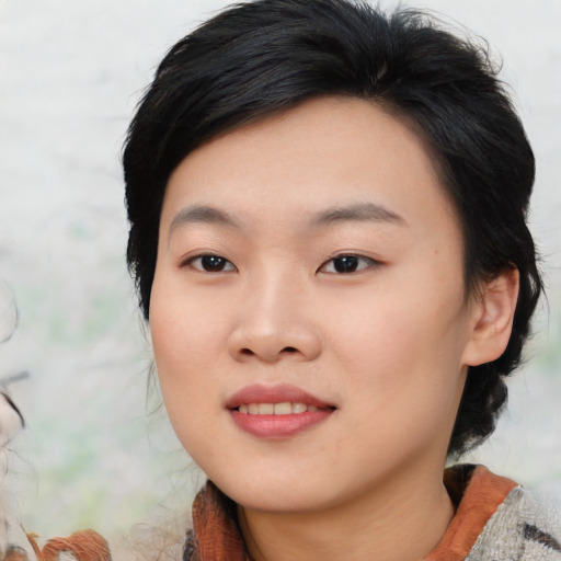Joyful asian young-adult female with medium  black hair and brown eyes