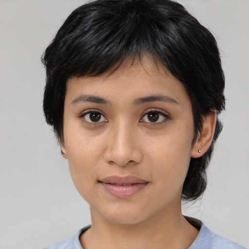 Joyful latino young-adult female with medium  black hair and brown eyes