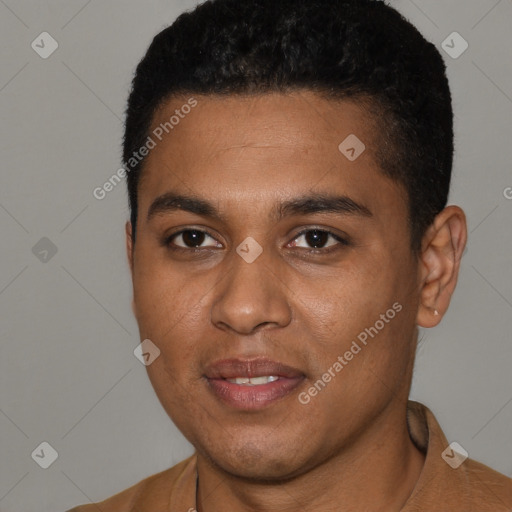 Joyful black young-adult male with short  brown hair and brown eyes