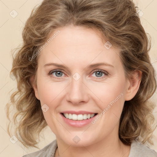 Joyful white young-adult female with medium  brown hair and green eyes