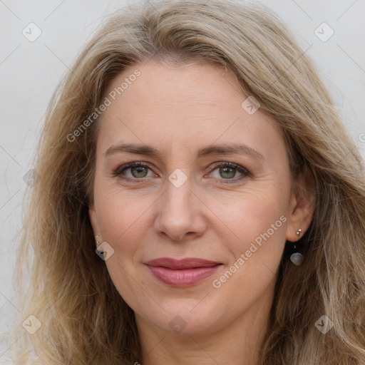 Joyful white adult female with long  brown hair and grey eyes