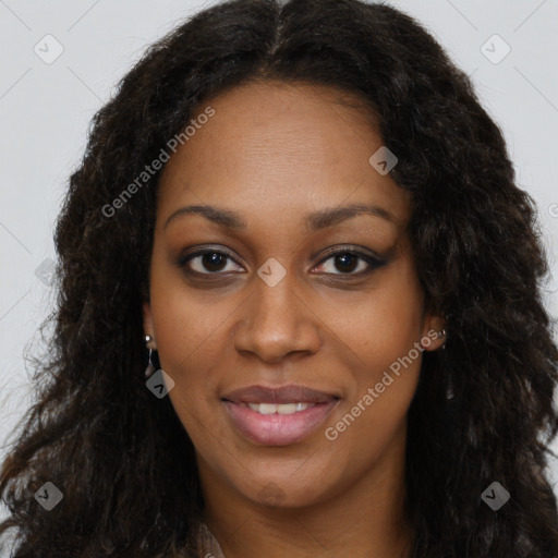 Joyful black young-adult female with long  brown hair and brown eyes