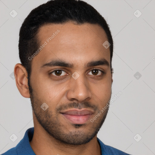 Joyful latino young-adult male with short  black hair and brown eyes