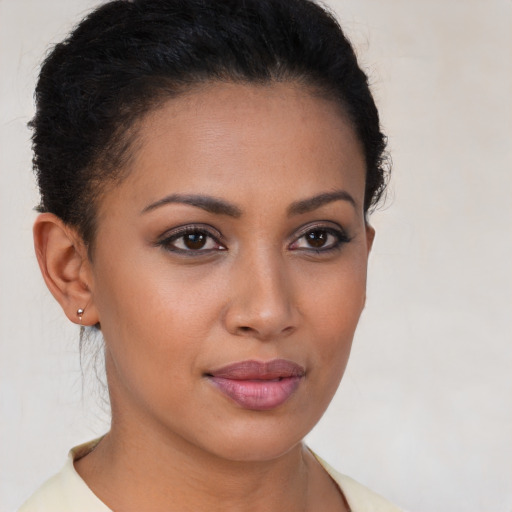 Joyful latino young-adult female with short  brown hair and brown eyes