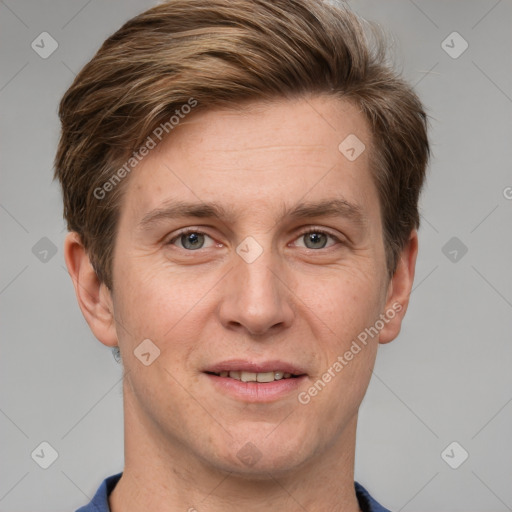 Joyful white adult male with short  brown hair and grey eyes