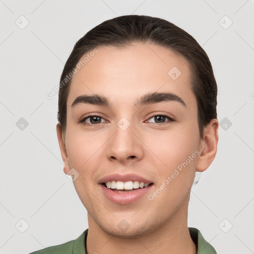 Joyful white young-adult male with short  brown hair and brown eyes