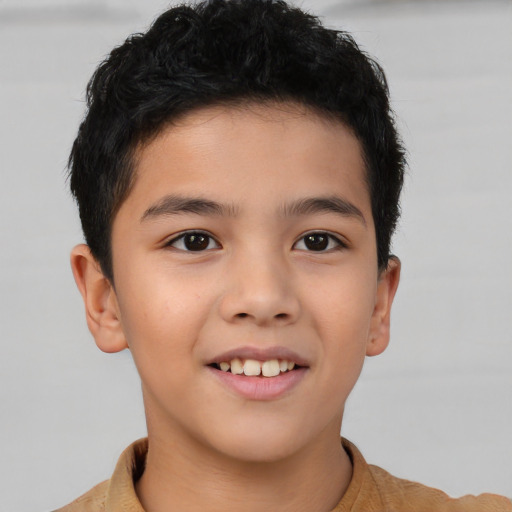 Joyful asian child male with short  brown hair and brown eyes