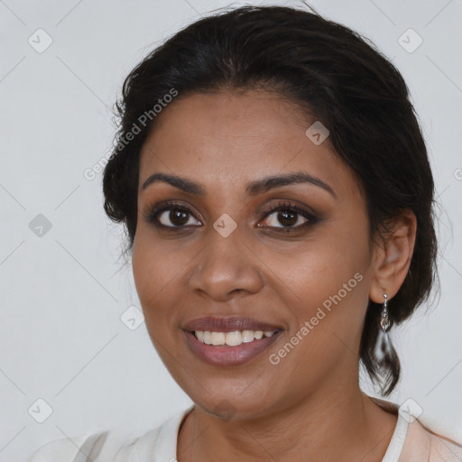 Joyful black young-adult female with medium  brown hair and brown eyes