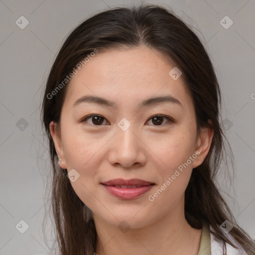 Joyful asian young-adult female with medium  brown hair and brown eyes