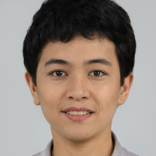 Joyful white young-adult male with short  black hair and brown eyes