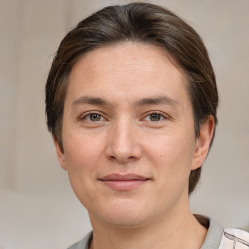 Joyful white young-adult female with short  brown hair and brown eyes