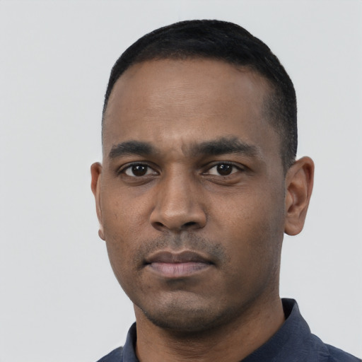 Neutral black young-adult male with short  black hair and brown eyes