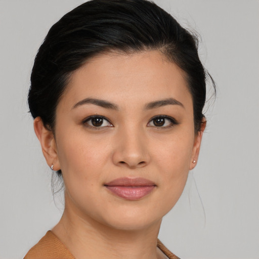 Joyful asian young-adult female with short  brown hair and brown eyes