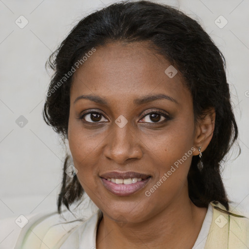 Joyful black adult female with medium  brown hair and brown eyes