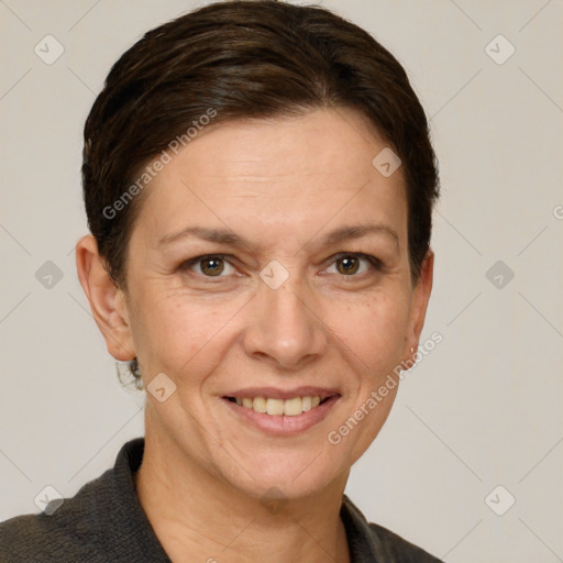 Joyful white adult female with short  brown hair and grey eyes