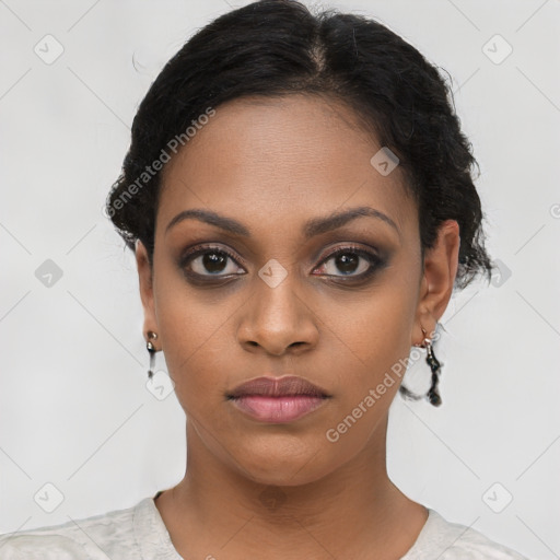 Joyful black young-adult female with short  black hair and brown eyes