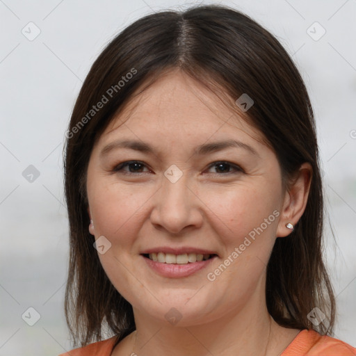 Joyful white adult female with medium  brown hair and brown eyes