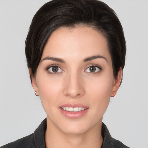 Joyful white young-adult female with medium  brown hair and brown eyes