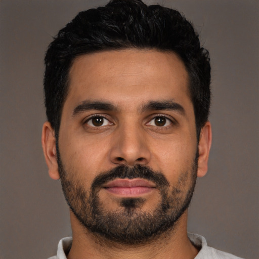 Neutral latino young-adult male with short  brown hair and brown eyes