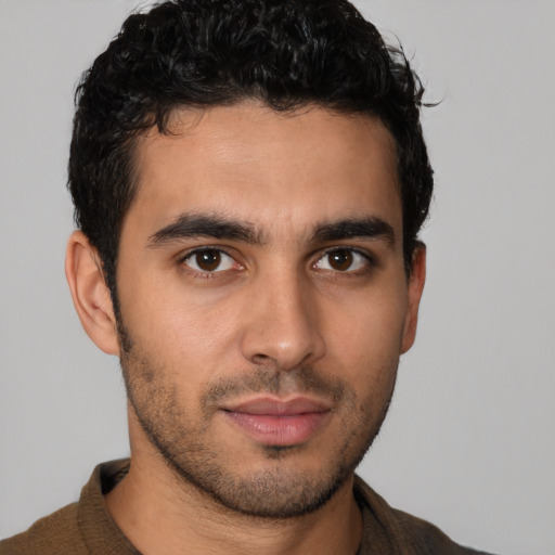 Neutral latino young-adult male with short  brown hair and brown eyes