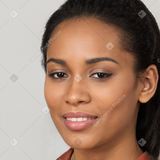 Joyful latino young-adult female with long  black hair and brown eyes