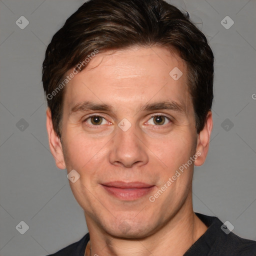 Joyful white adult male with short  brown hair and brown eyes