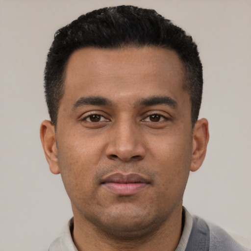 Neutral latino young-adult male with short  black hair and brown eyes