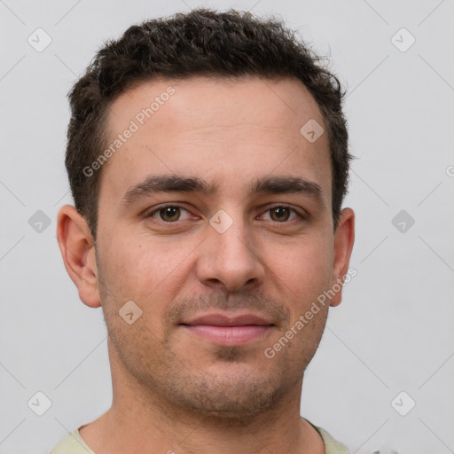 Joyful white young-adult male with short  brown hair and brown eyes