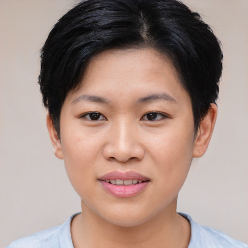Joyful asian young-adult female with short  black hair and brown eyes