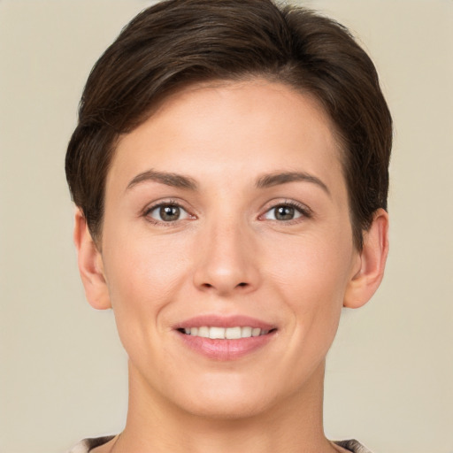 Joyful white young-adult female with short  brown hair and brown eyes