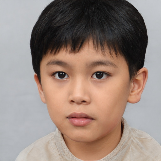 Neutral asian child male with short  brown hair and brown eyes