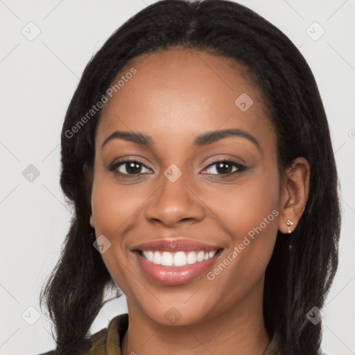 Joyful latino young-adult female with long  brown hair and brown eyes