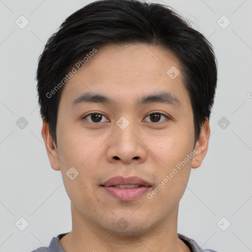 Joyful asian young-adult male with short  brown hair and brown eyes