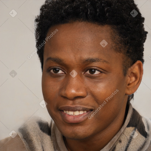 Joyful black young-adult male with short  brown hair and brown eyes