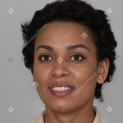 Joyful black young-adult female with short  brown hair and brown eyes