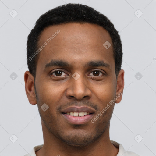 Joyful black young-adult male with short  black hair and brown eyes