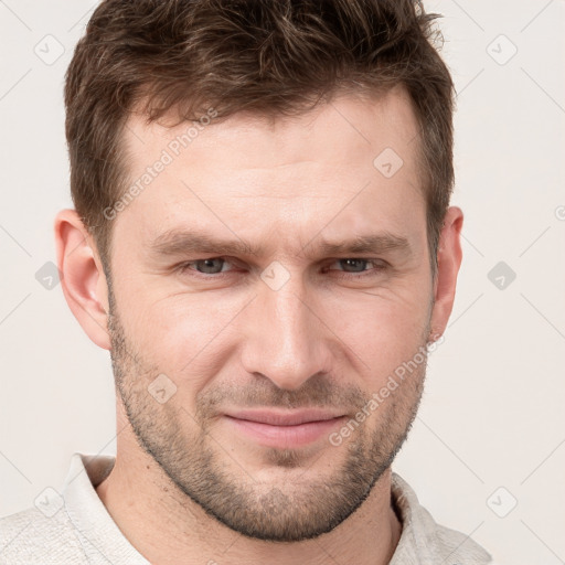 Joyful white adult male with short  brown hair and grey eyes