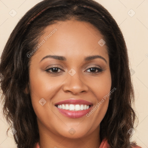 Joyful latino young-adult female with long  brown hair and brown eyes