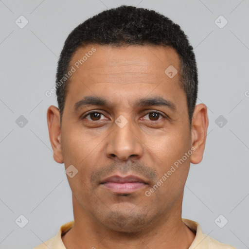 Neutral latino young-adult male with short  black hair and brown eyes