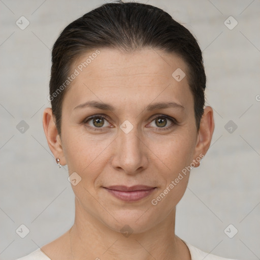 Joyful white adult female with short  brown hair and brown eyes