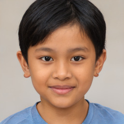 Joyful asian child male with short  brown hair and brown eyes