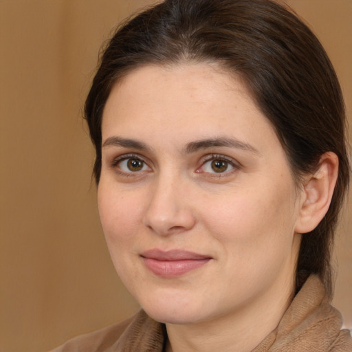 Joyful white young-adult female with medium  brown hair and brown eyes