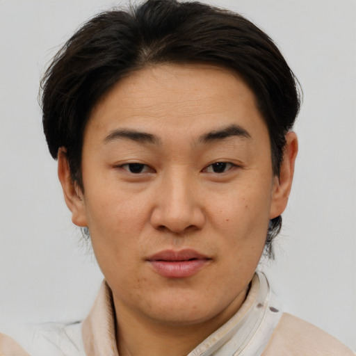 Joyful asian young-adult female with short  brown hair and brown eyes