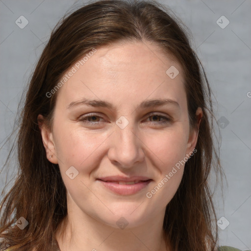 Joyful white adult female with long  brown hair and grey eyes