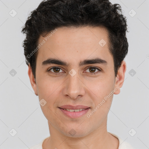 Joyful white young-adult male with short  black hair and brown eyes