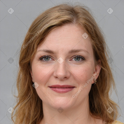 Joyful white young-adult female with medium  brown hair and blue eyes