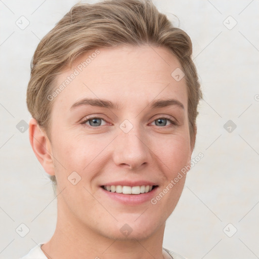 Joyful white young-adult female with short  brown hair and grey eyes