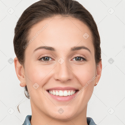 Joyful white young-adult female with medium  brown hair and grey eyes